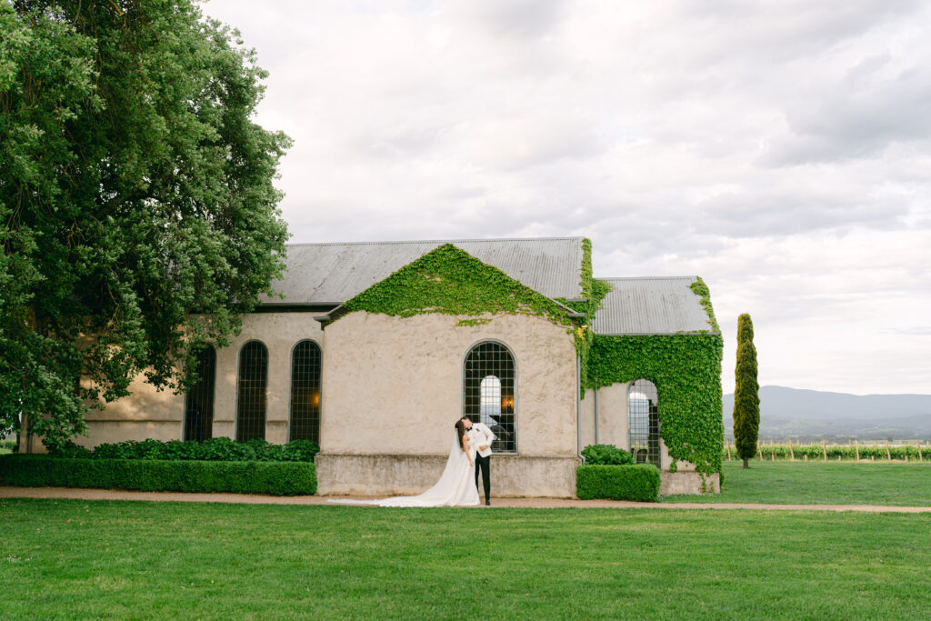 Stones of the Yarra Valley Chapel with couple walking in front