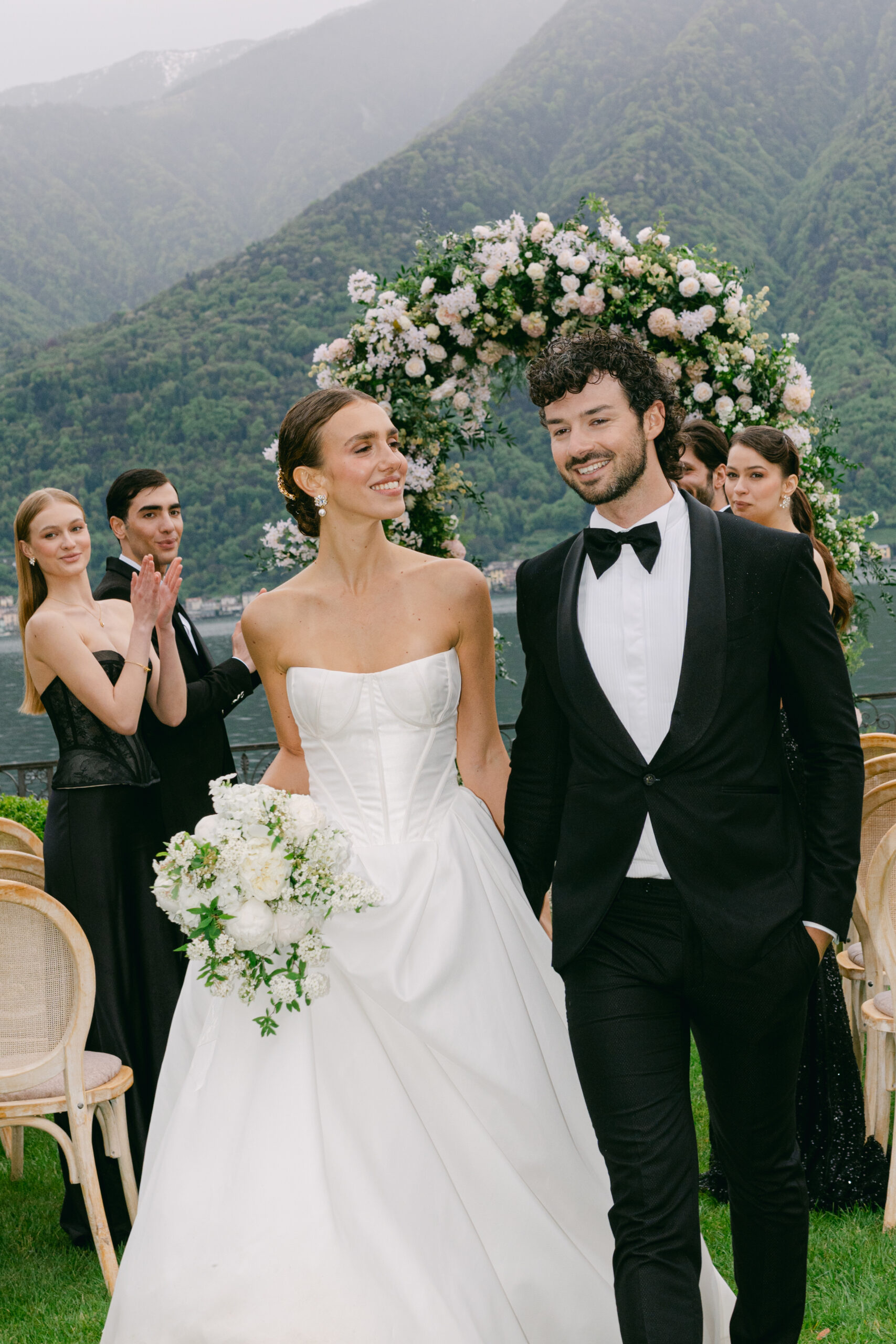 A married couple walking down the aisle after the ceremony
